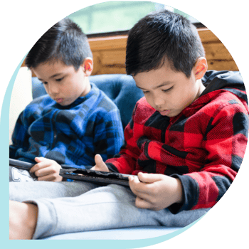 2 young children viewing ipads 2 young children viewing ipads